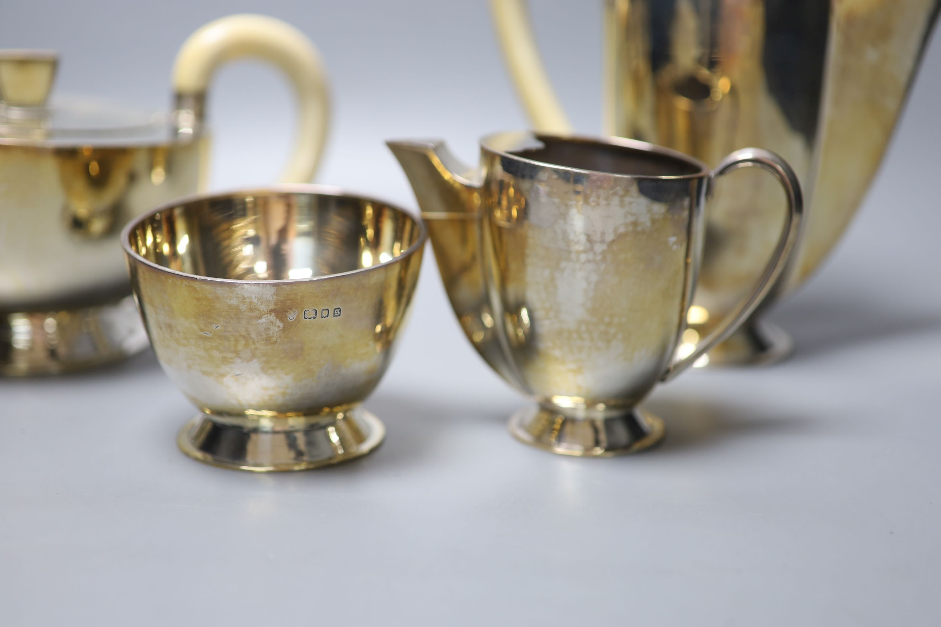 A George V Art Deco four piece silver tea set by Charles Boyton, London 1933, gross 48oz,